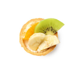Tartlet with orange, banana and kiwi isolated on white, top view. Delicious dessert