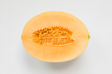 Half of juicy melon on white background, top view