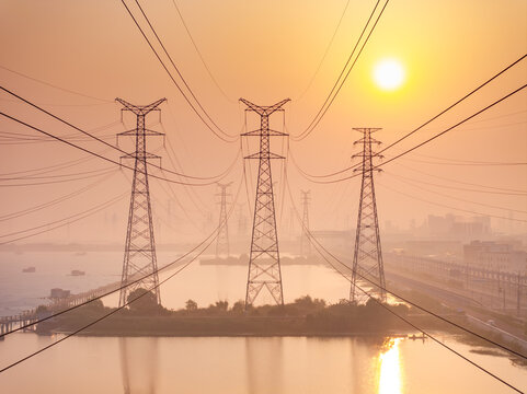 High voltage electricity tower landscape at sunset