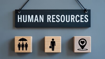 Wooden blocks with human resources icons on a gray background.