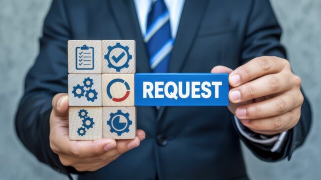 Businessman holding wooden blocks with a request displayed.