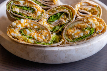 Healthy breakfast devil egg wraps with lettuce in a bowl. Close-up photo of a fresh and simple meal, perfect for a light and tasty start to the day