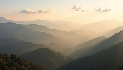 Fototapeta premium Hazy mountain range at sunset with layers of ridges and forest