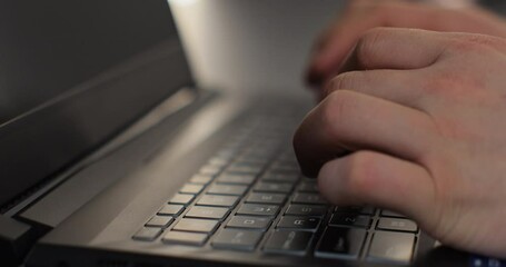 Male hands professional user using typing on laptop notebook keyboard sit at home. Man fingers tapping and texting on computer browsing online. - Powered by Adobe