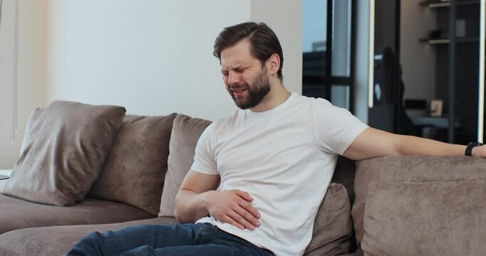 Male having symptom poisoning diarrhea indigestion peptic ulcer pancreatitis at home. People health care problem.