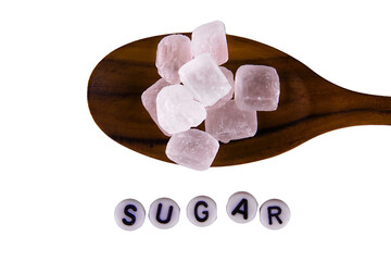 white sugar on a wooden spoon