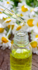 Chamomile Essential Oil Dropper with Fresh Flowers