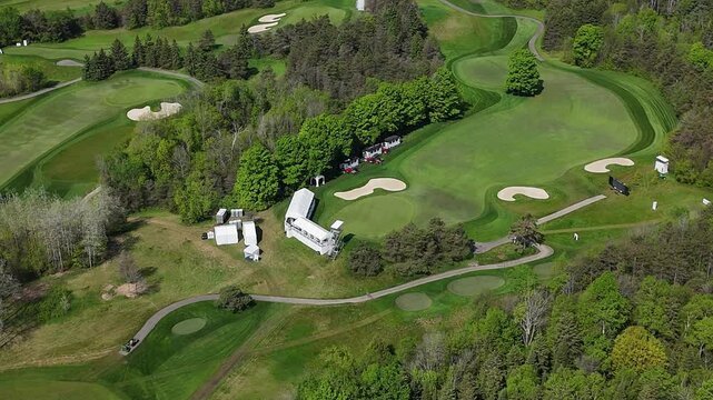 Orbit drone shot of TPC Toronto at Osprey Valley Golf Course during the day in Alton, Caledon, Ontario, Canada