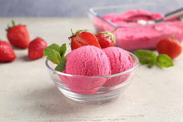 Tasty sorbet with strawberries and mint served on light table, closeup