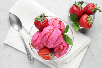 Tasty sorbet with strawberries and mint served on light table, flat lay
