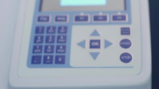 Researcher or scientific putting 96 well micro plate into plate reader quantitative PCR machine to measure and analyze DNA or RNA quantification in a biotechnology laboratory