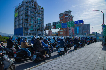 A cityscape of traffic jam at the bike street near Taipei bridge