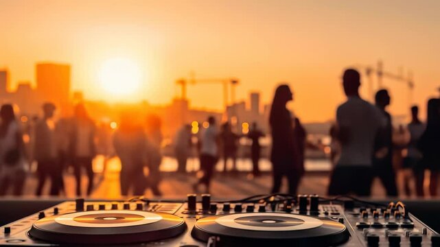DJ playing music at sunset open-air festival: crowd dancing on rooftop party, city skyline background. 4K video footage, nightlife, summer vibes, live event, youth culture, concert