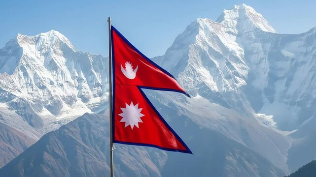 Nepal flag waving against the backdrop of snow-capped Himalayan mountains on a clear day