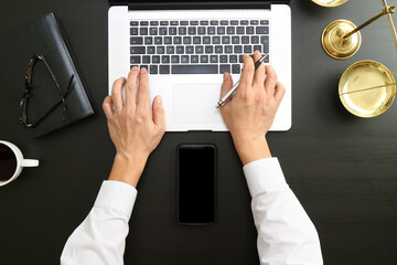 Lawyer Working at Desk with Laptop and Smartphone Mockup