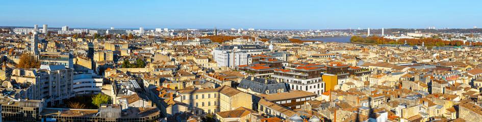 Stunning panoramic aerial cityscape from Pey Berland tower of St. Andrew's Cathedral beautiful sunny evening of warm golden autumn, Bordeaux, Gironde, Nouvelle-Aquitaine, France.