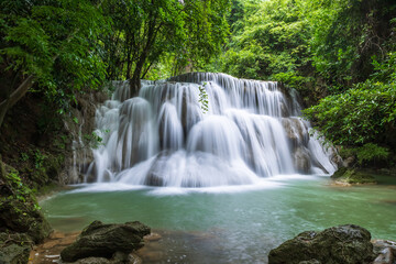 Tropical waterfall at Huay Mae Khamin national park in lush rainforest, Tier 3 Wang Na Pha, Kanchanaburi, Thailand