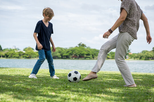 Happy family parent children having picnic outdoor activity. Enjoy happiness moment summer playing together including father mother son and daughter relaxing in the morning sunrise.