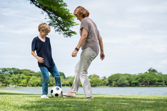 Happy family parent children having picnic outdoor activity. Enjoy happiness moment summer playing together including father mother son and daughter relaxing in the morning sunrise.