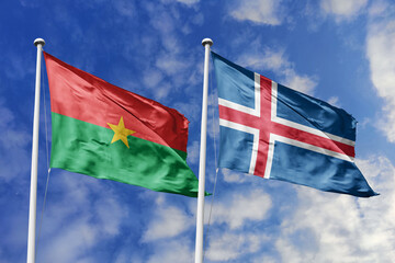  Flags of Burkina Faso and Iceland Waving Together Against a Blue Sky, Symbolizing Diplomatic Ties and Global Connections