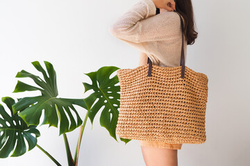 Woman holding Reusable shopping bag on white background. Natural material. Zero waste. Plastic free. Eco friendly concept. 