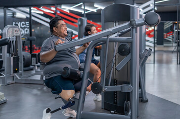 smiling obesity man,person with prosthetic leg doing sport training on fitness equipment,athlete,desire to lose weight,be strong,health and rehab