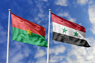 A Burkina Faso and Syria flag, a metaphor for Middle East-African ties, wave together against a...