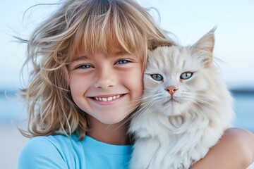A 5-7 year old girl with blonde hair in a blue t-shirt hugs a white fluffy cat