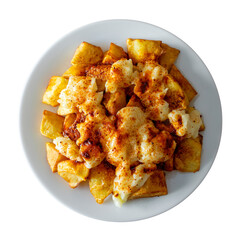 A plate of patatas bravas with aioli and spicy paprika shot from above and isolated on empty background. A typical Spanish tapa
