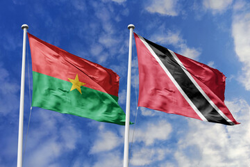 A Burkina Faso and Trinidad and Tobago flag, a metaphor for Caribbean-African ties, wave together...