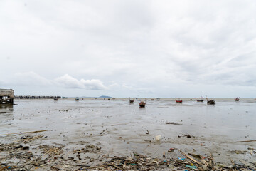 A beach with a lot of boats in the water