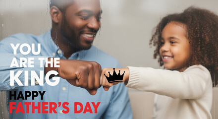 Father and child celebrating Father's Day with fist bump showing love and connection