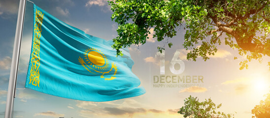 Kazakhstan flag waving in the sky. A couple hike and enjoy a break look at the top of the mountain adventure travel. Kazakhstan national flag for independence day.