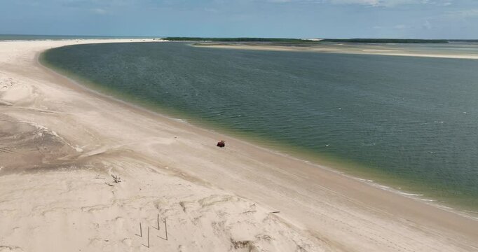 Aerial View Of Person Riding An ATV On The Sandy Banks Of Parnaiba River In Brazil.