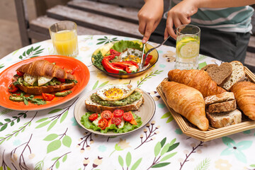Brunch, Breakfast, Croissant, Avocado Toast, Poached Egg, Ham, Eggs Benedict, Croissant Sandwich, Baked Goods, Breakfast Table, Brunch Table, Breakfast Pastries, Toast, Cherry Tomatoes, Arugula, Crisp