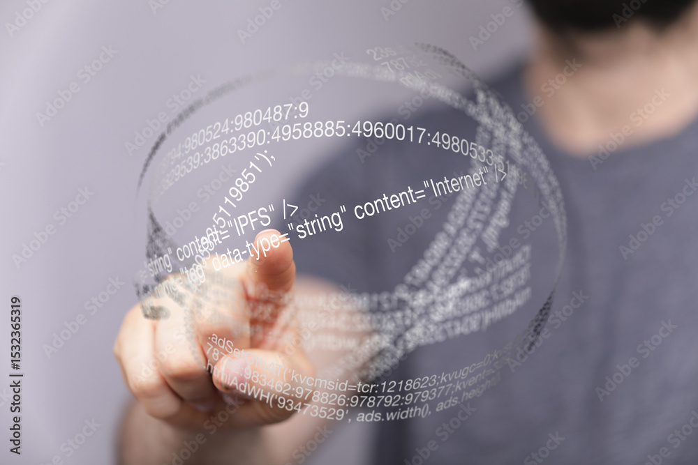 Poster Close-up of a man's hand interacting with a futuristic holographic display showing code and data.