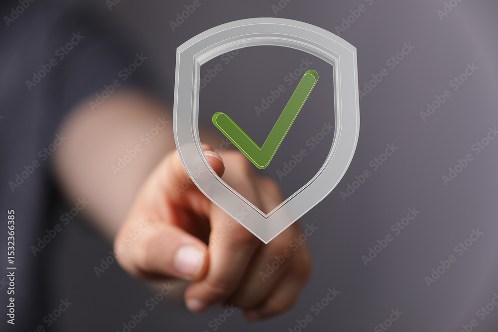 Poster High-quality image of a hand interacting with a digital shield graphic, representing data security and protection.