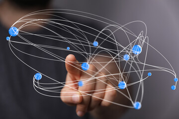 Abstract image of a hand interacting with a digital network. Ideal for technology, connectivity,...