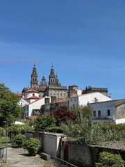 Obraz premium A group of buildings with a tower in the background