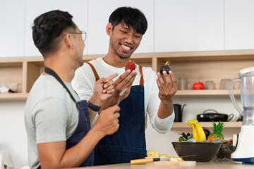 LGBTQ Couple Cooking Together in Modern Kitchen