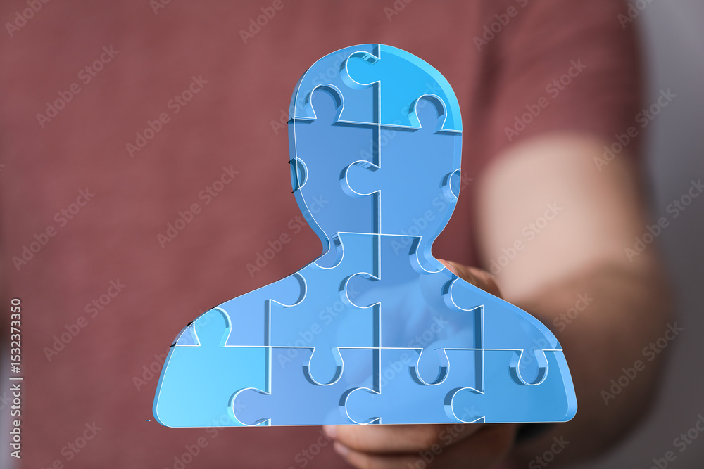 Poster abstract image of a person made of puzzle pieces. teamwork, collaboration, unity.