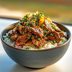 Savory Beef and Rice Bowl with Sesame Seeds and Green Onions