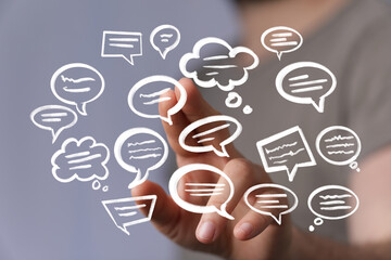 Image of hand holding multiple speech bubbles, ideal for communication, social media, and teamwork...
