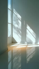 Obraz premium Sunlight streaming through a window casting shadows on a blank wall