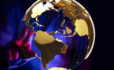 Hand reaching for a golden globe, symbolizing global reach and international business.