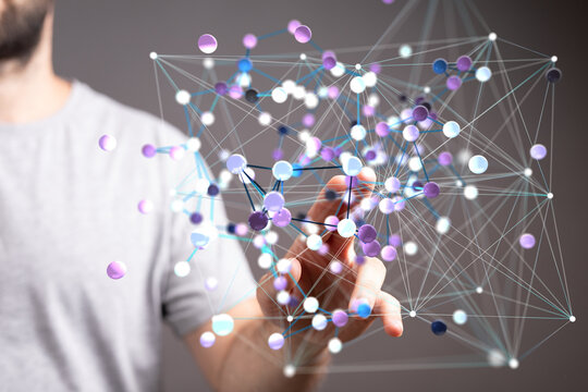 Abstract image of a person interacting with a digital network visualization, representing connectivity and data flow.