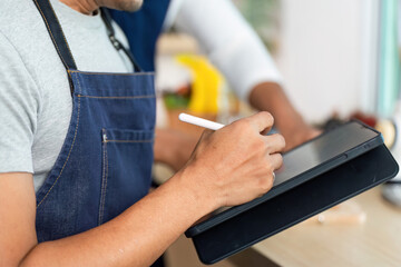 LGBTQ Couple Engaging in Culinary Creativity with Tablet