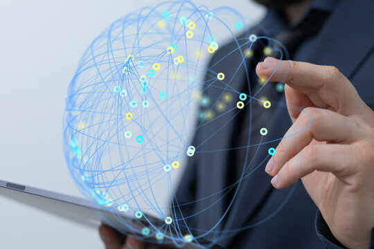 Person interacts with a digital globe representing global network connections on a tablet.