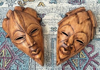 Traditional African Wooden Masks on Decorative Fabric