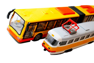 Toys tram and bus on a white background, city transport.
